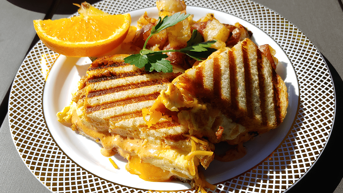 A closer look at the panini with potatos, orange slice and Element 79 wine.